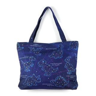 Blue tote bag with dinosaur constellation design on a white background