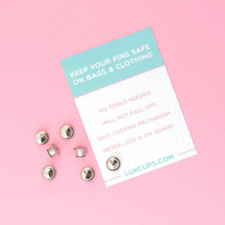 a pack of pin locks sitting on top of a pink surface