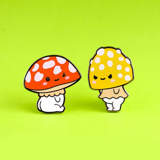 a couple of mushrooms sitting on top of a green surface